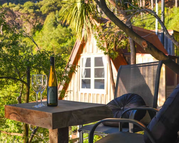 A view of the pointy roof at Akaroa Coastal Cottage one of the best beach house Airbnbs NZ