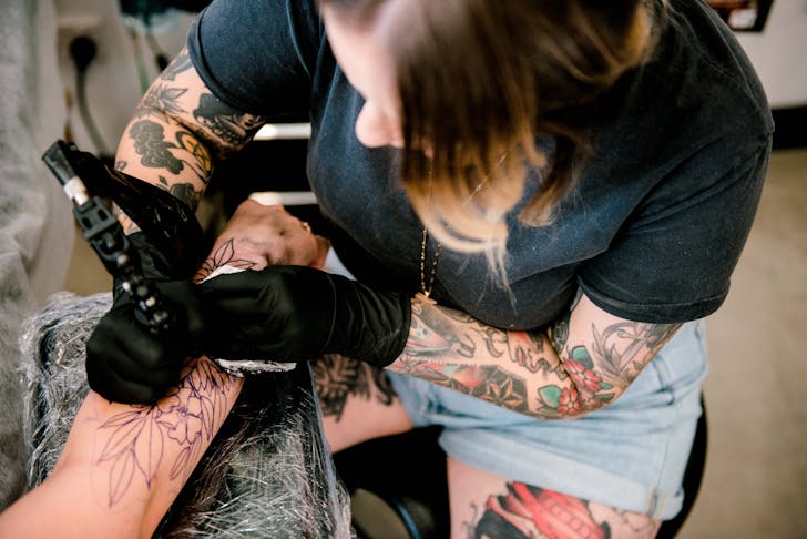 a tattooist at a gold coast tattoo parlour