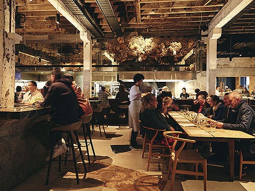 The understated dining room at Amano is buzzing with patrons.