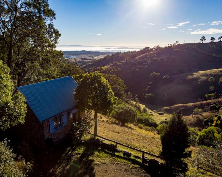 A view of Amelies Cottage romantic Airbnb overlooking the Hunter Valley landscape