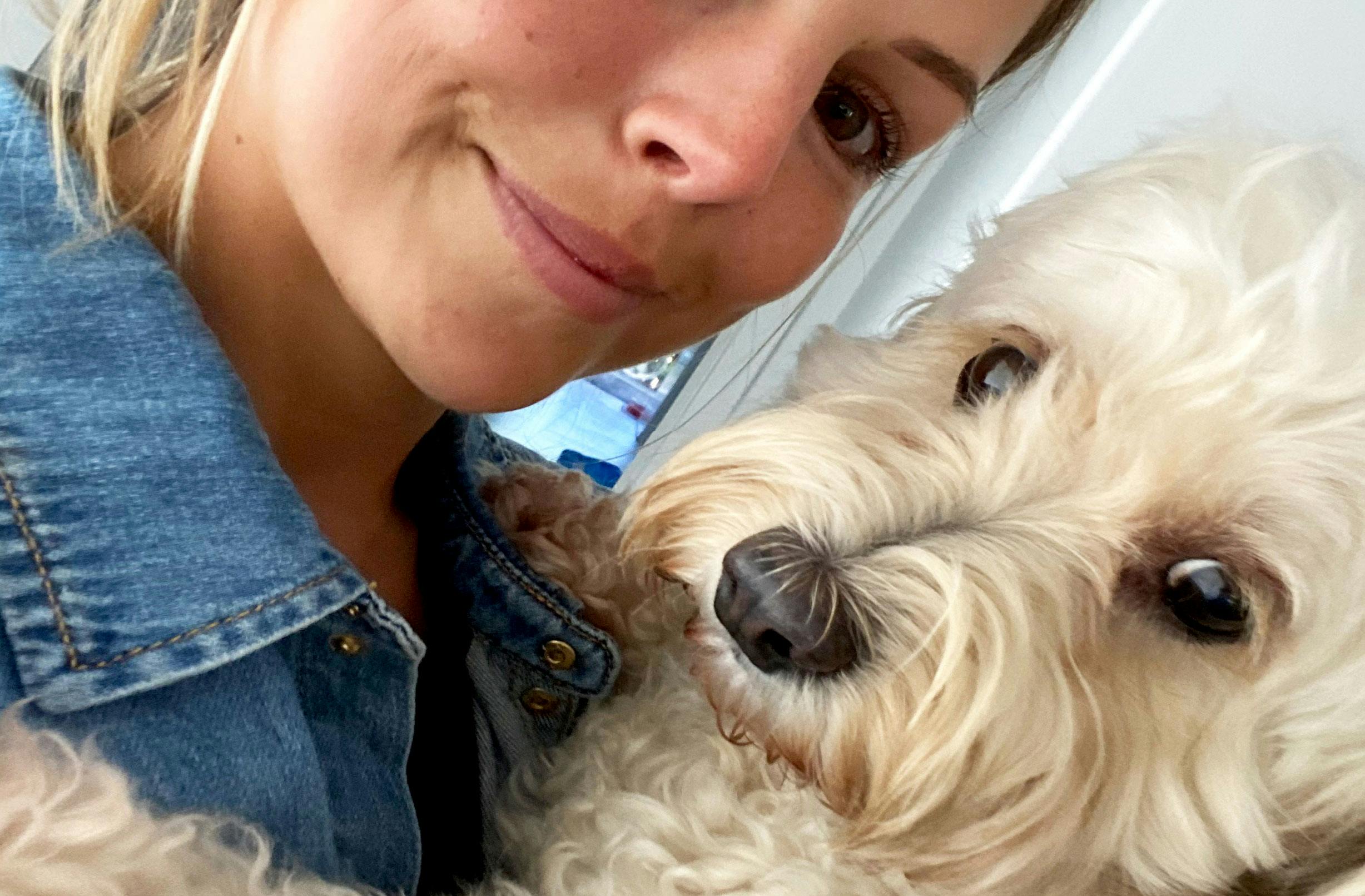 Woman takes a selfie with her dog