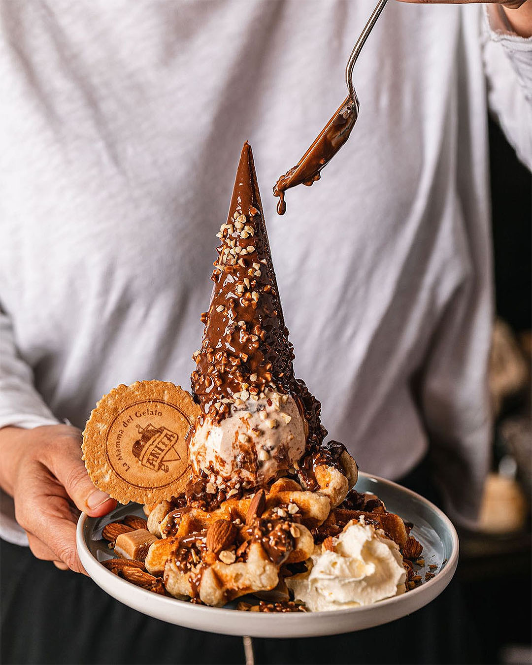 When you order Anita Gelato at Upper Village Queenstown's Belgian waffles you’ll receive two irresistibly fragrant waffles, two scoops of your choice of gelato, Anita’s special chocolate sauce, whipped cream, crushed nuts and your choice of toppings.  