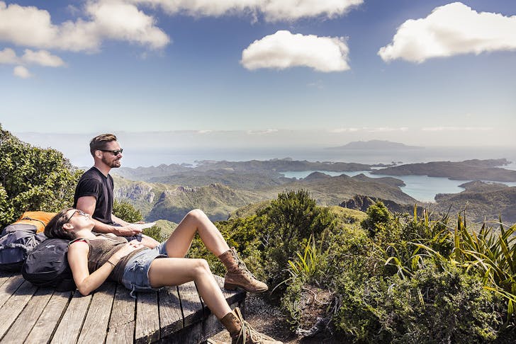 Two people taking a break on the Aotea Track, Great Barrier Island 
