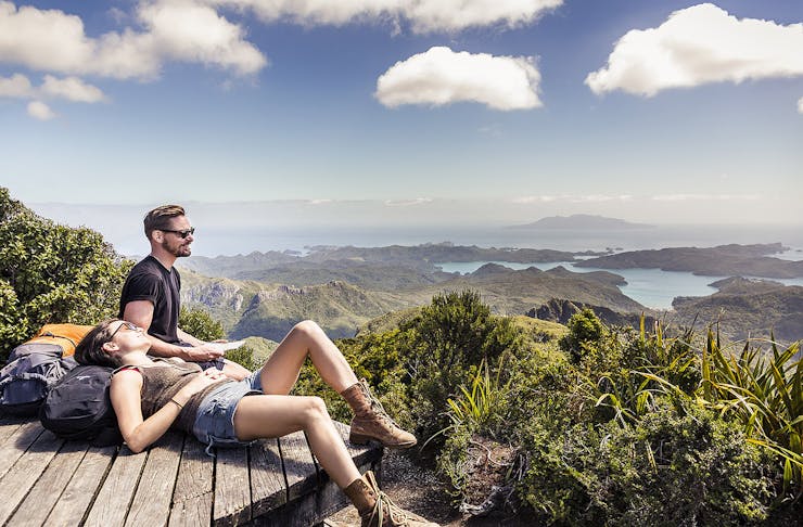 Two people taking a break on the Aotea Track, Great Barrier Island 