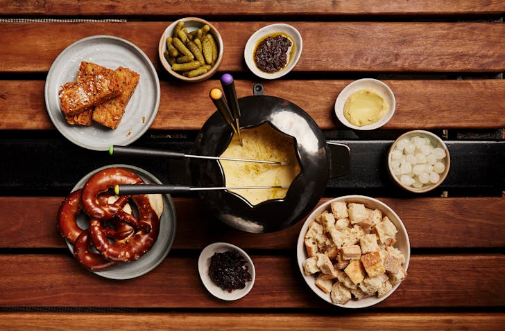 A helping of triple-cheese fondue, including dipping pretzels, crudites, pickles and baguette served at Arbory Bar & Eatery on Melbourne's Yarra River.