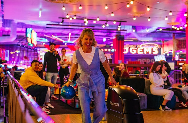 Someone has fun bowling at Archie Bros Cirque Electriq.