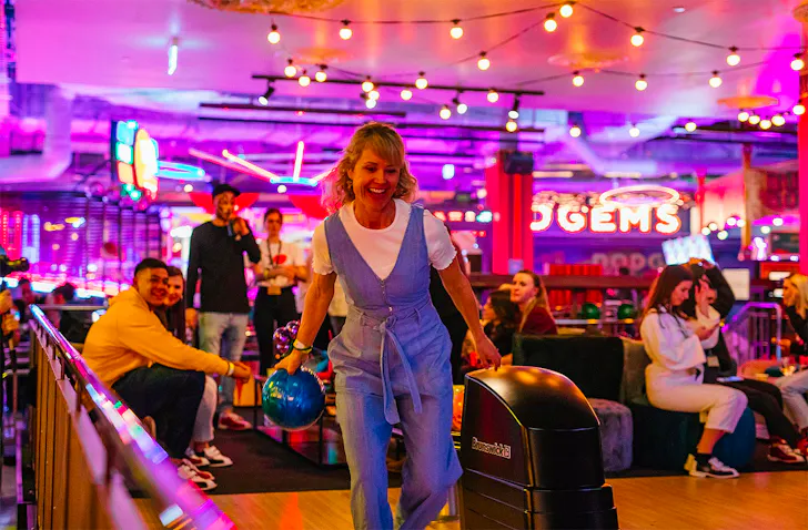 Someone has fun bowling at Archie Bros Cirque Electriq.