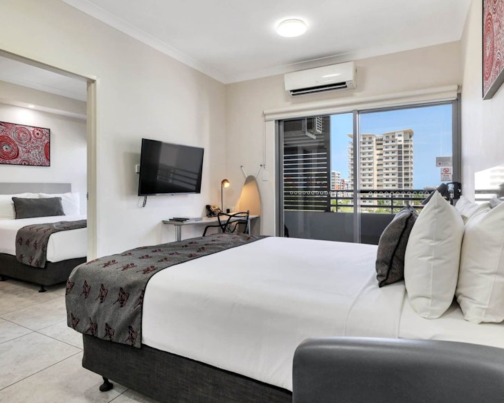 A view of a room with a double bed and TV at Argus Hotel Darwin one of the best Darwin hotels