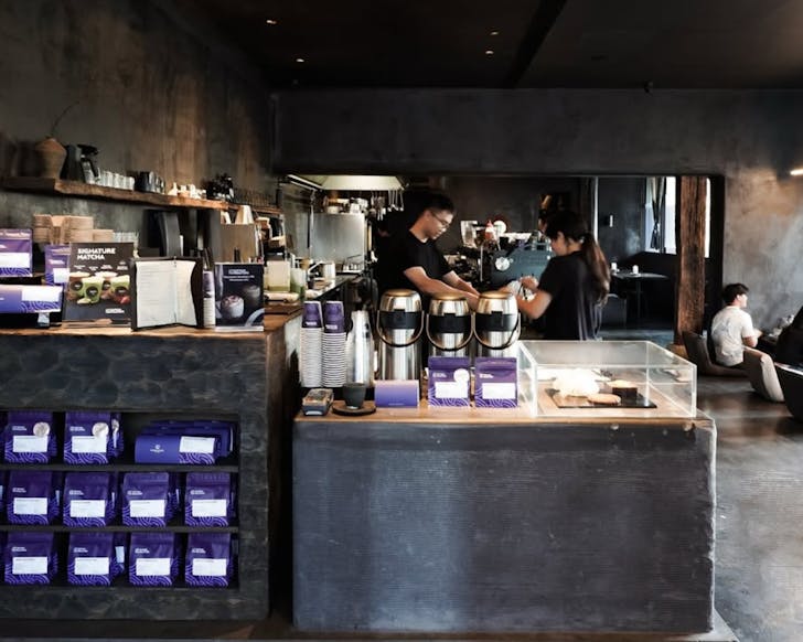 the charcoal-toned interior of the edition roasters cafe in haymarket