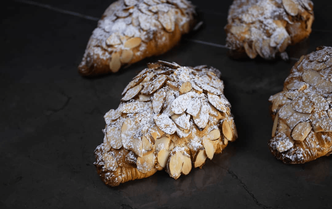 An almond croissant from one of the best bakeries in Melbourne, Artisanal Bakehouse.