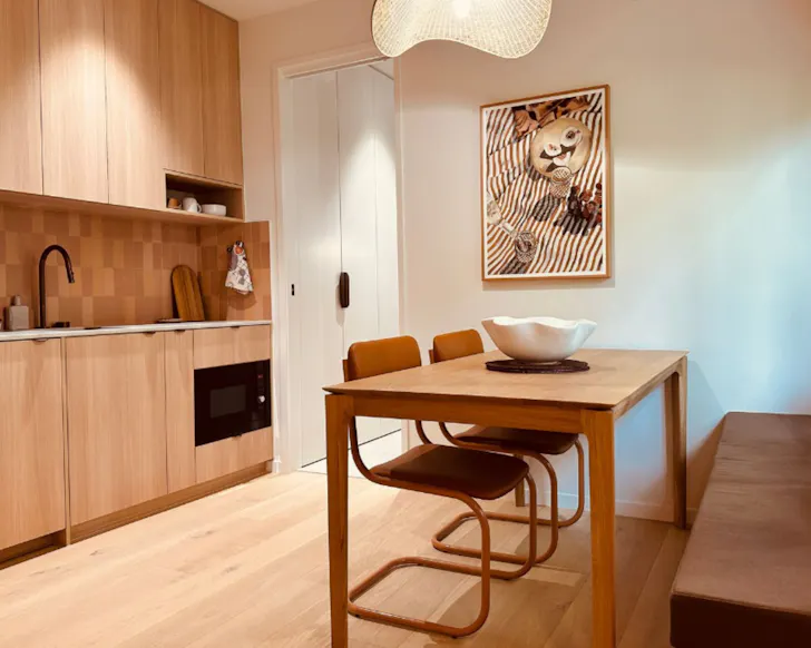 The stylish kitchen and dining space at Aurora best Cairns Airbnbs