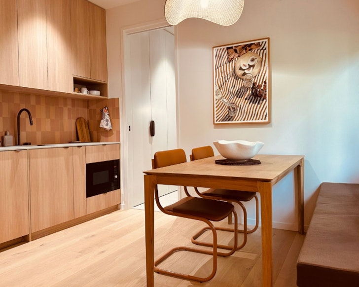 The stylish kitchen and dining space at Aurora best Cairns Airbnbs