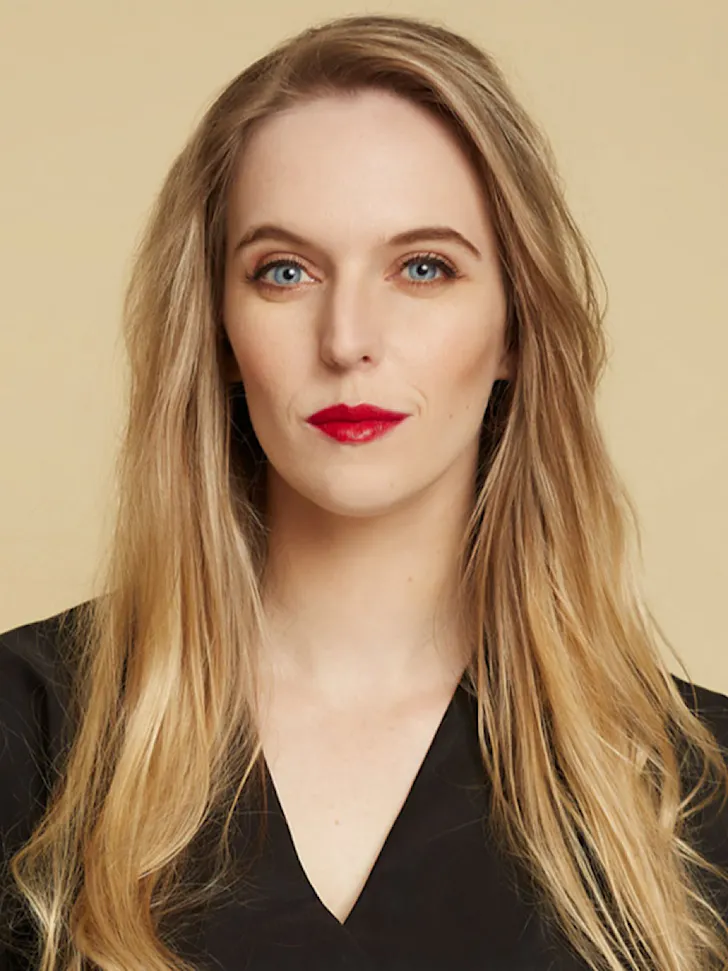 Ava in her signature black 'fit and red lipstick.