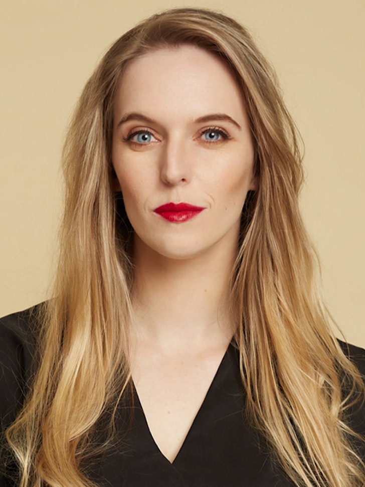 Ava in her signature black 'fit and red lipstick.