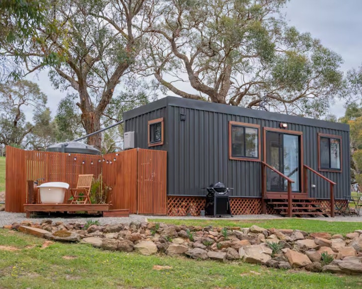An exterior view of the bath and tiny home Away At Ancell