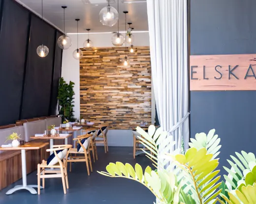 Restaurant titled Elska, with wooden features.