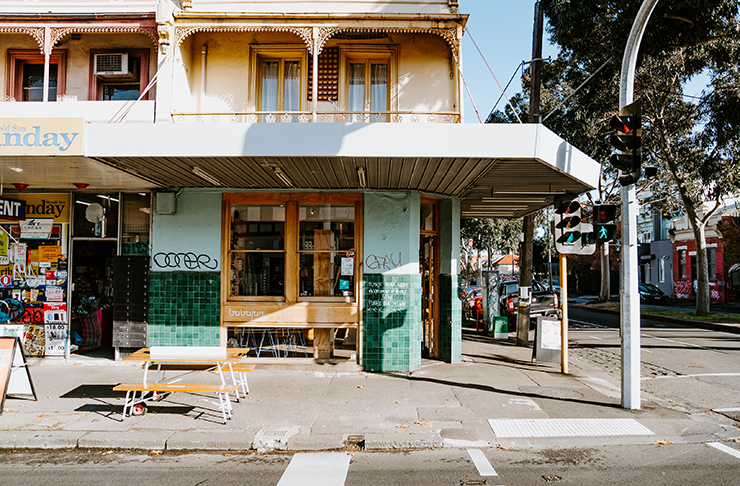 A shot of a corner store with the doors open to one of best cafes in Melbourne  