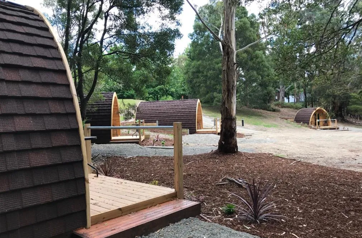 Four wine barrel-like glamping pods, a great glamping victoria option.