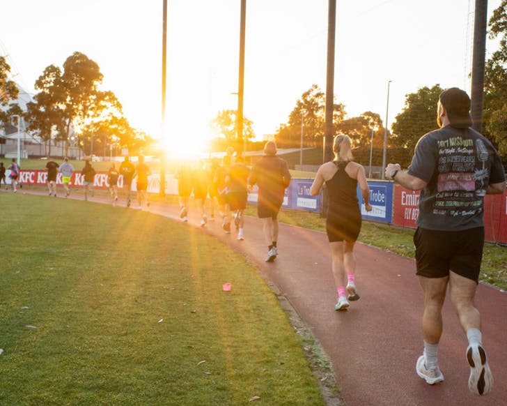 People running a sunset track