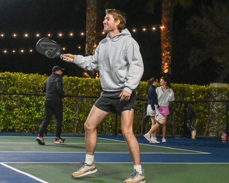 Man hitting pickleball
