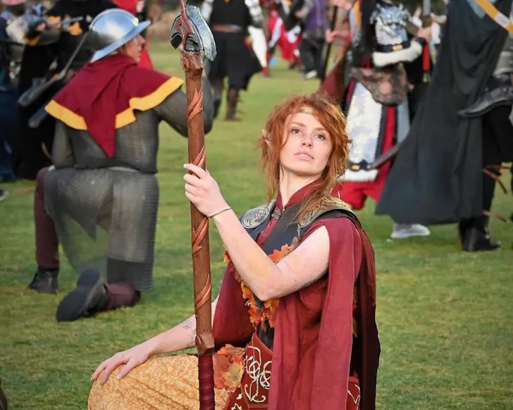 Person posing with sword