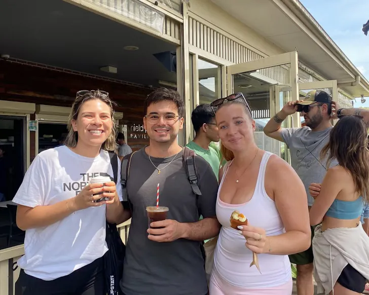 Three people smiling