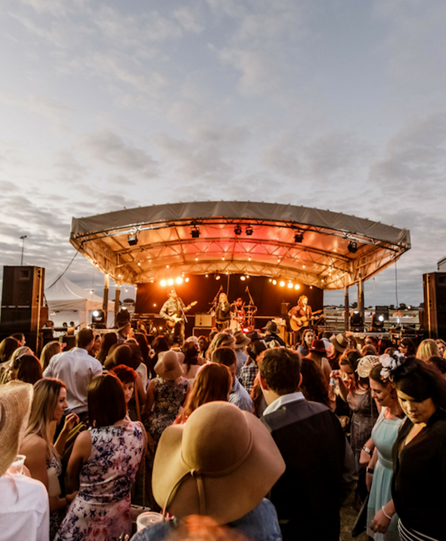 Punters dancing in front of a stage.