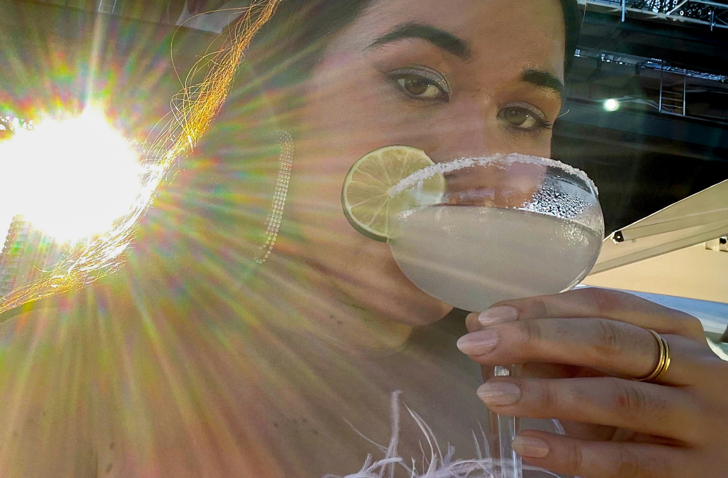 Woman takes a selfie with her cocktail