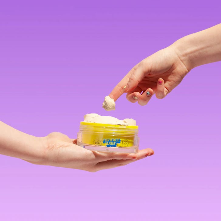 two hands holding mask 