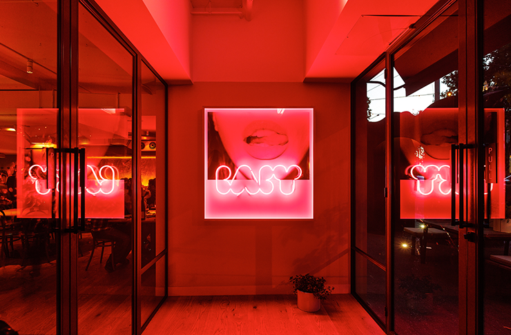 The red neon-lit entrance of one of the best Richmond restaurants.  