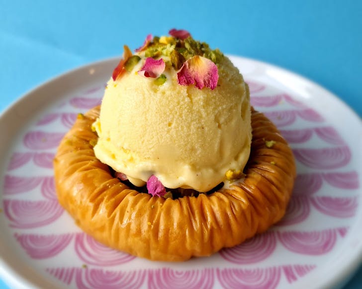 A scoop of Zelati gelato on a Levant Sweets baklava ring. 