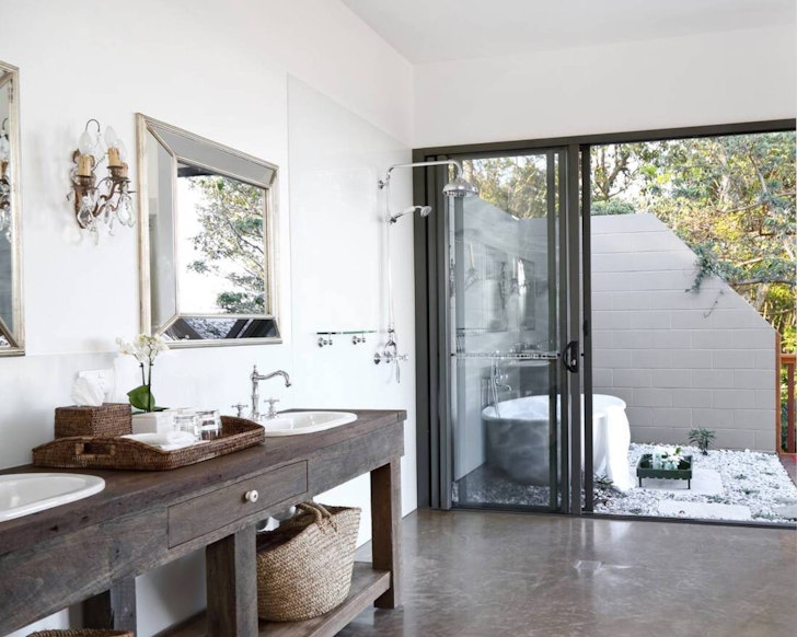 A view through the living space to the outdoor bath at Balmoral575 Bungalow near Brisbane Queensland