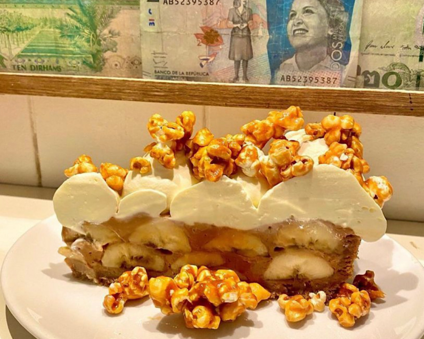 A mouth-watering cross-section of The Fed’s banana and toffee pie topped with whipped cream and caramel popcorn.  