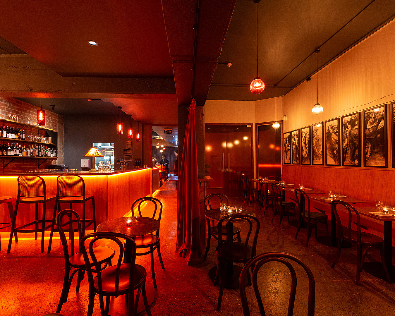 The stunning red-hued interior of Bar Magda.