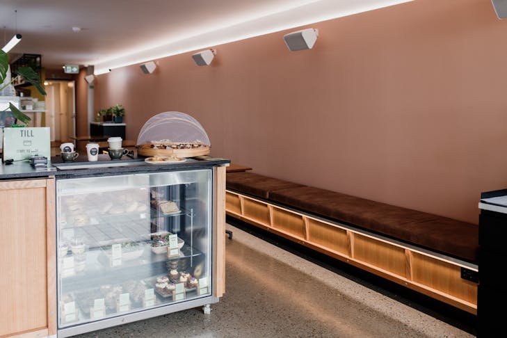 the salmon pink interior of a cafe