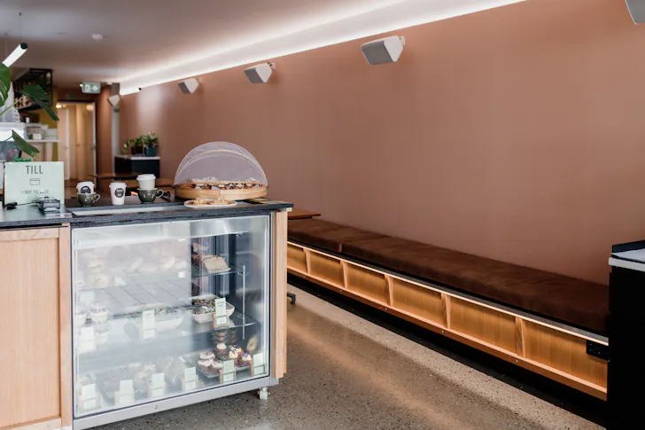 the salmon pink interior of a cafe