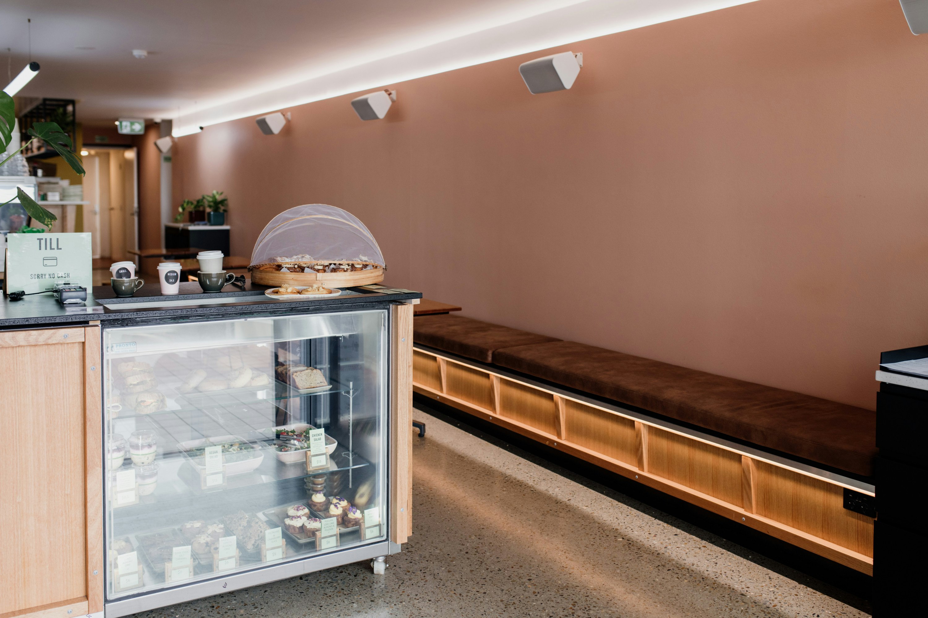 the salmon pink interior of a cafe