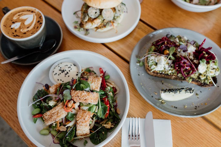 several dishes on a table and a coffee