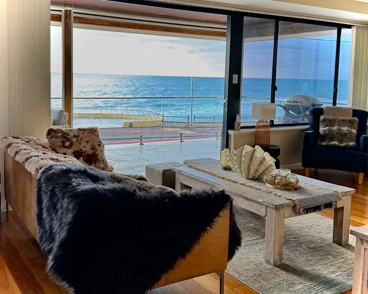 A view of the lounge with an ocean view at Barefoot North Beach House best pet-friendly Perth Airbnbs