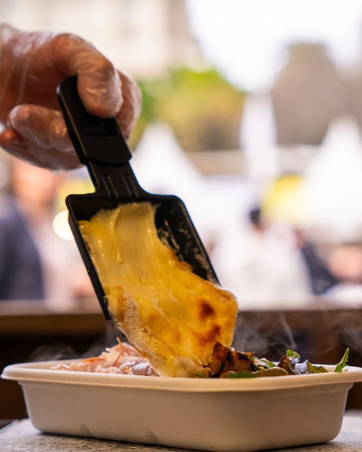 Cheese dripping into container.