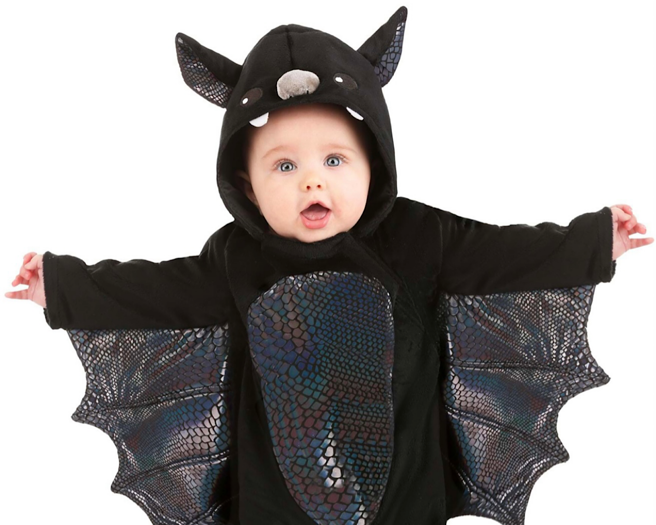 A cute toddler dressed in a bat Halloween costume. 