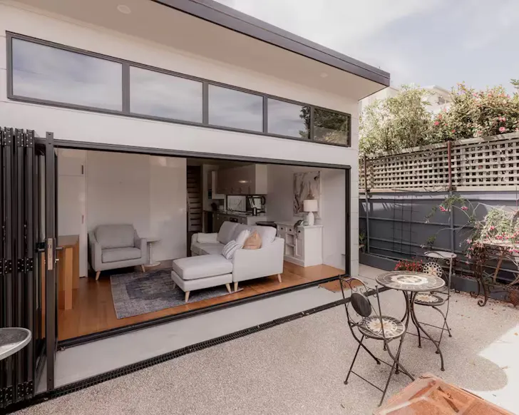 A view of the living space from the outdoor area at Battery Point Place one of the best Airbnbs in Hobart