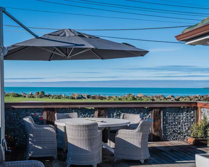 The sea view from the deck at Beach Bungalow one of the best beach house Airbnbs NZ