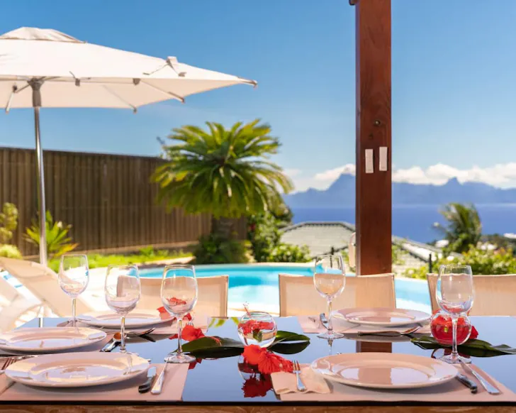 The dining table with a sea view at Beautiful 5 Bedroom Villa best Airbnbs Tahiti