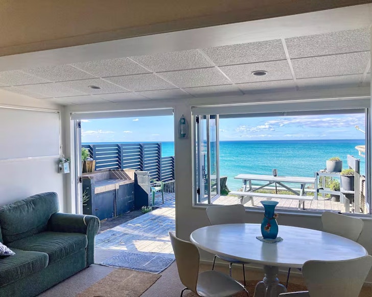 The sea view from the living space at Beauty On The Beachfront one of the best beach house Airbnbs NZ