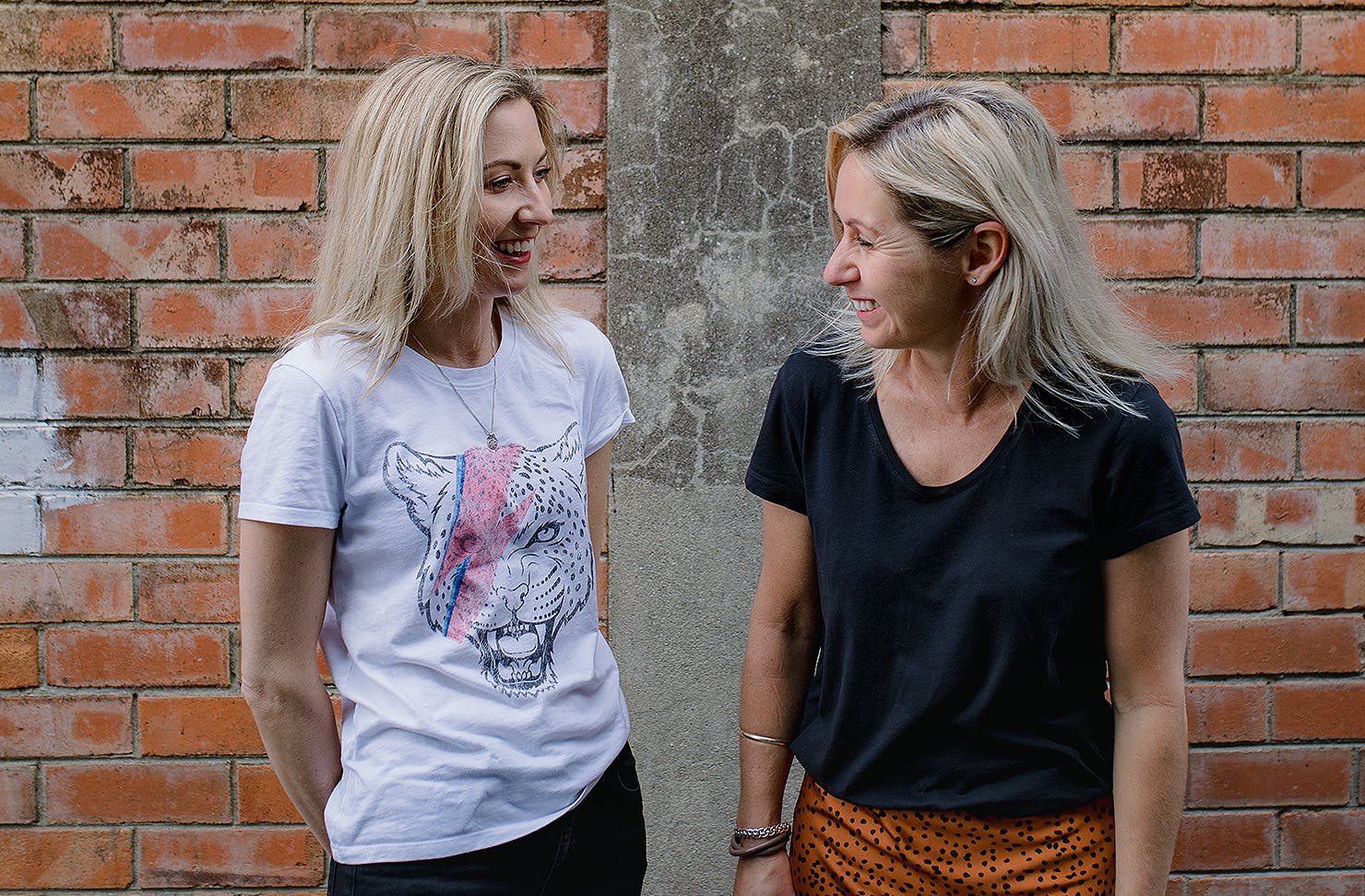 Bec and Carlie have a laugh.