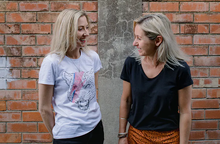 Bec and Carlie have a laugh.