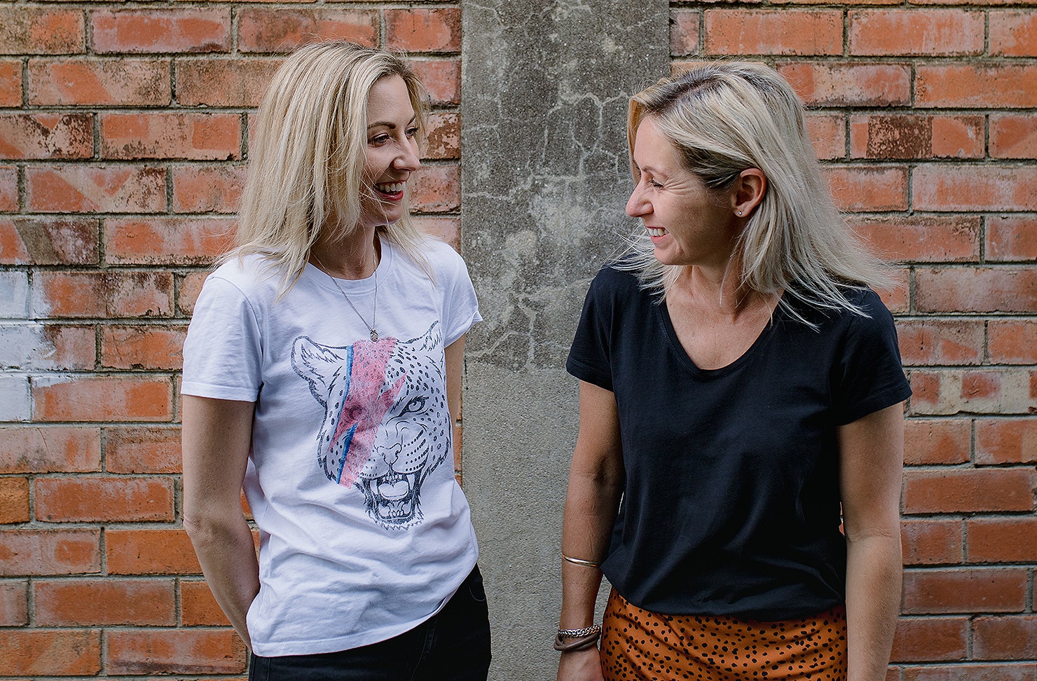 Bec and Carlie have a laugh.