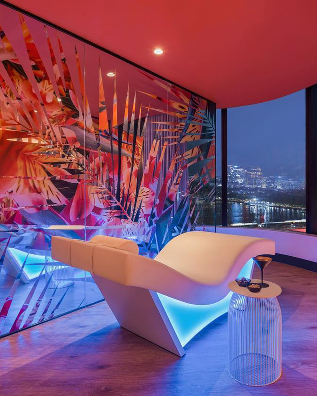 A neon-lit lounger at Away Spa