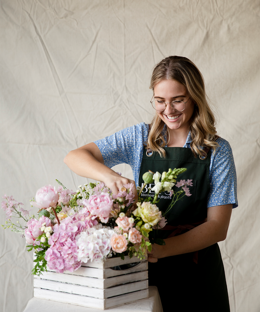 a florist arranging a bouquet